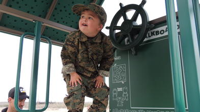 Wish kid Zach explores his military themed playset